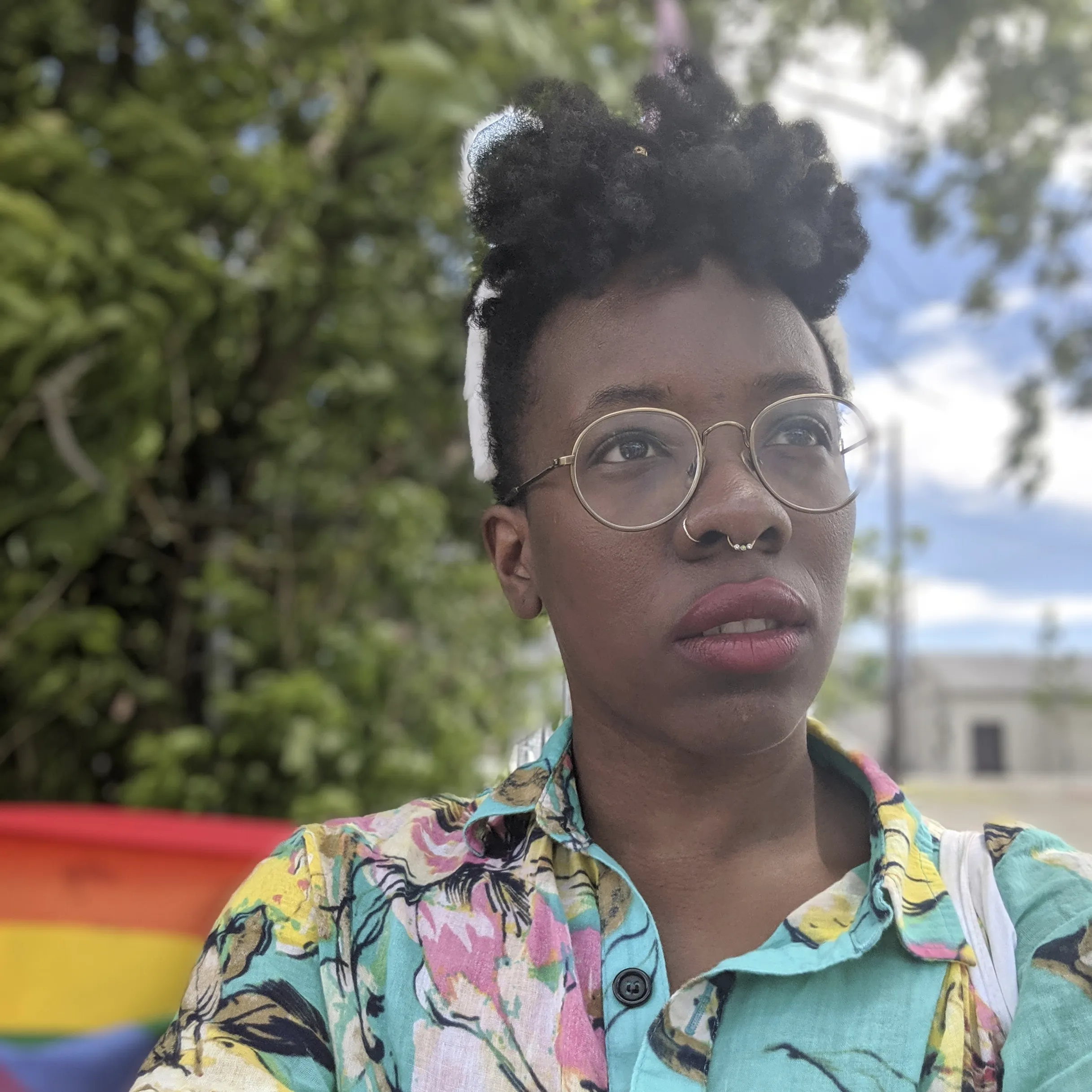 A rainbow themed image of Thalida